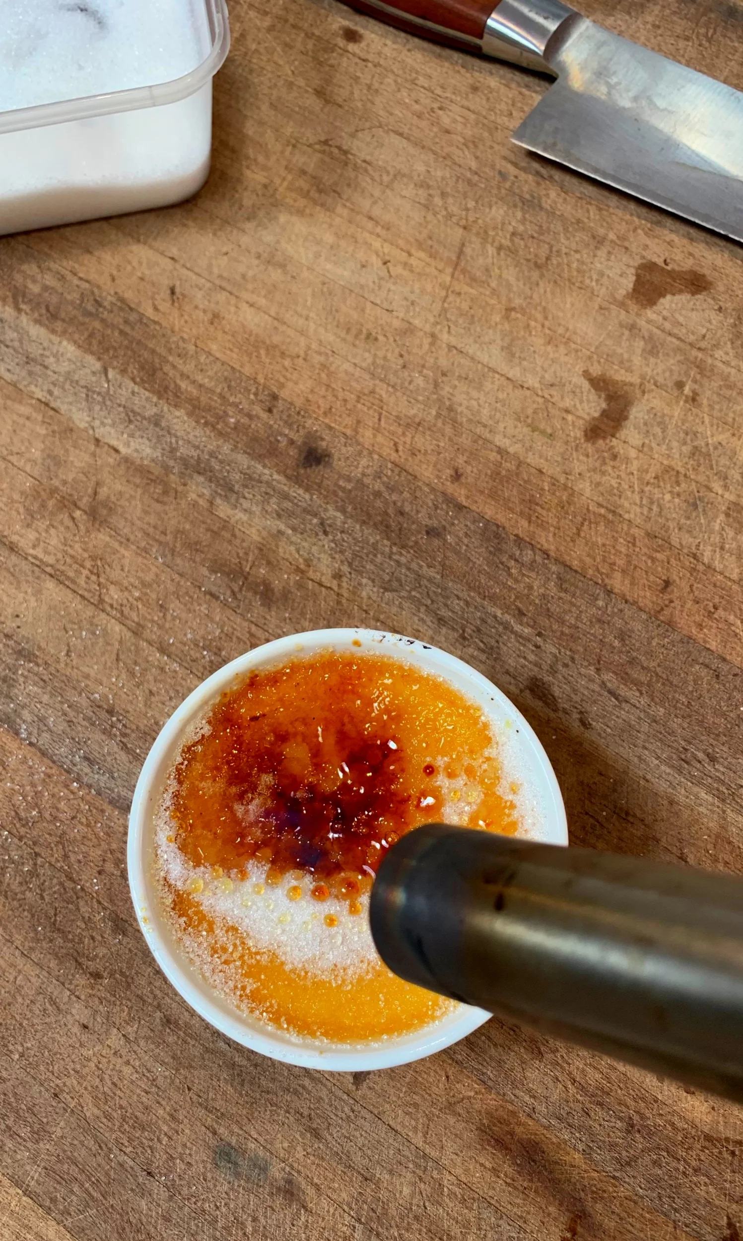 Crème Brulee with vanilla poached strawberries