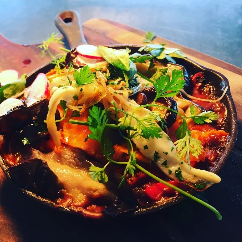 Vegetarian baked eggs with eggplant and peppers