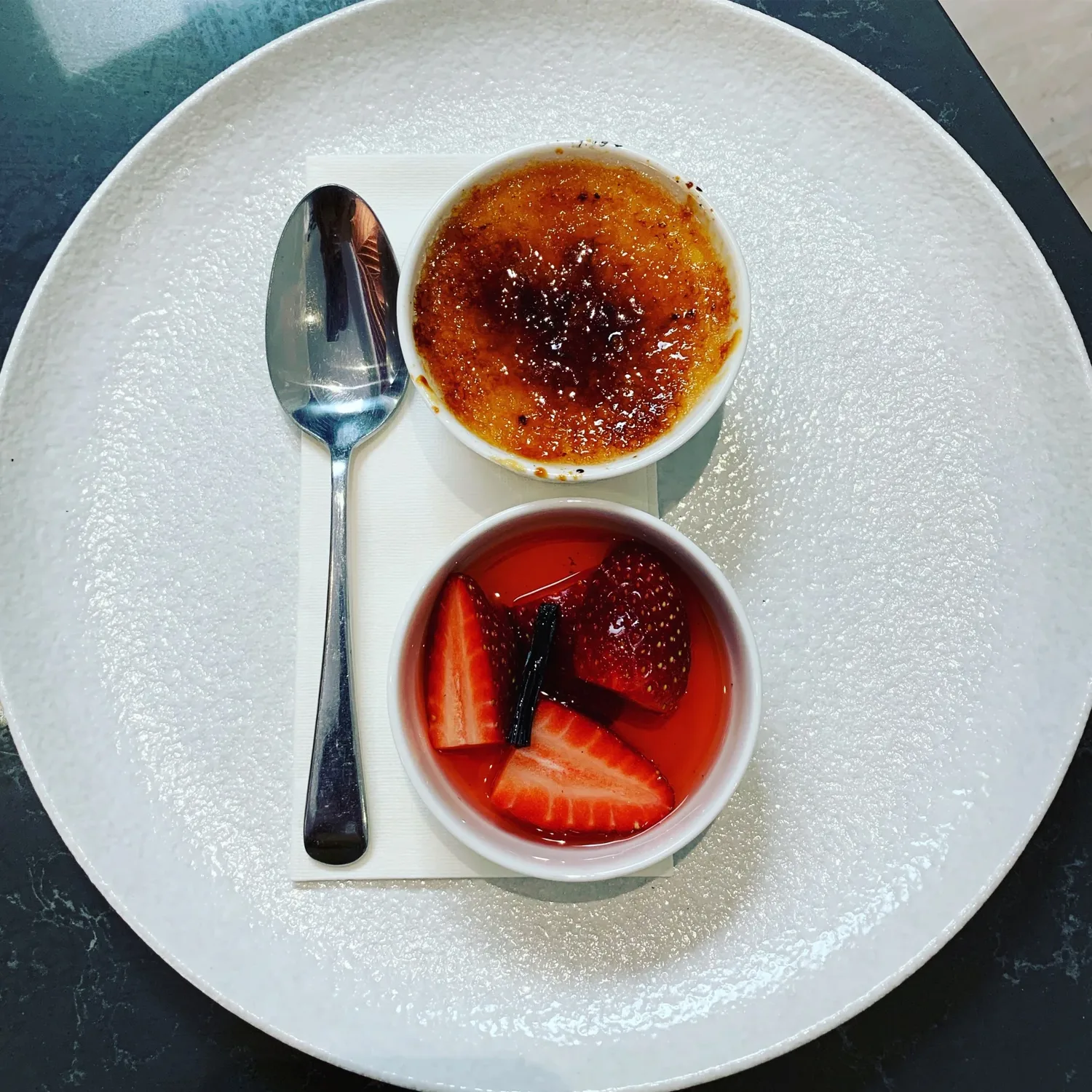 Crème Brulee with vanilla poached strawberries