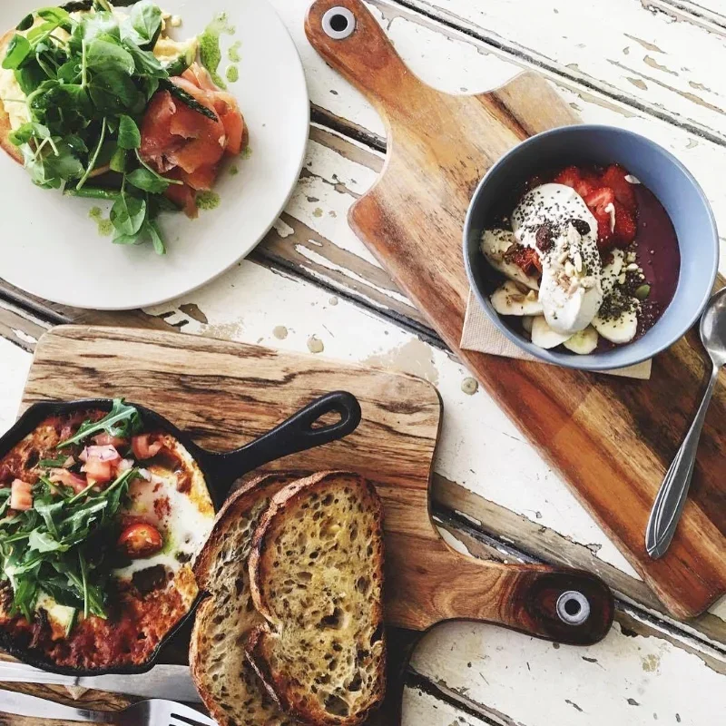 Breakfast dishes, Oven baked eggs, chorizo and beans, Eggs, asparagus and salmon, Acai bowl.